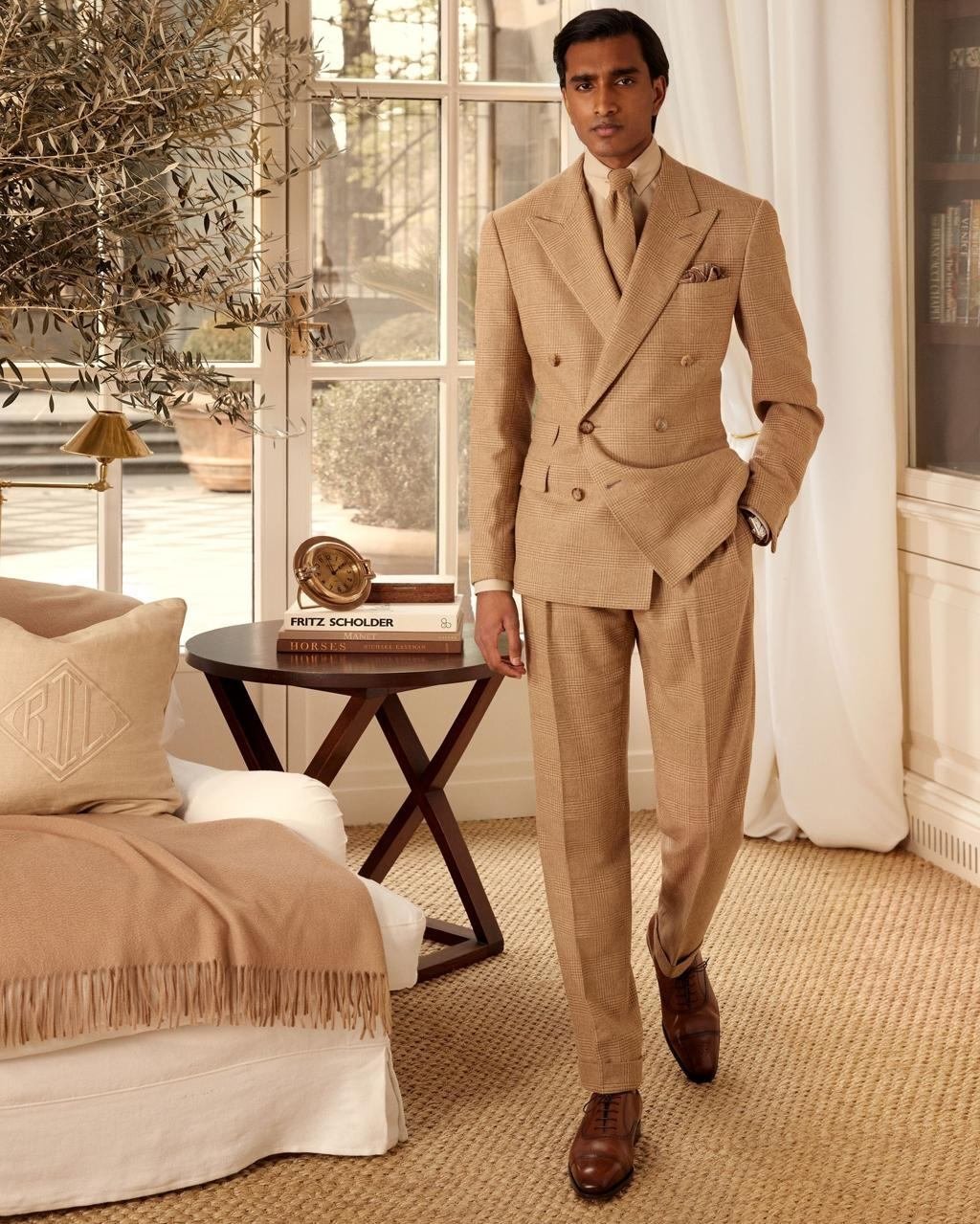 Tan checked double-breasted suit with a refined, classic silhouette